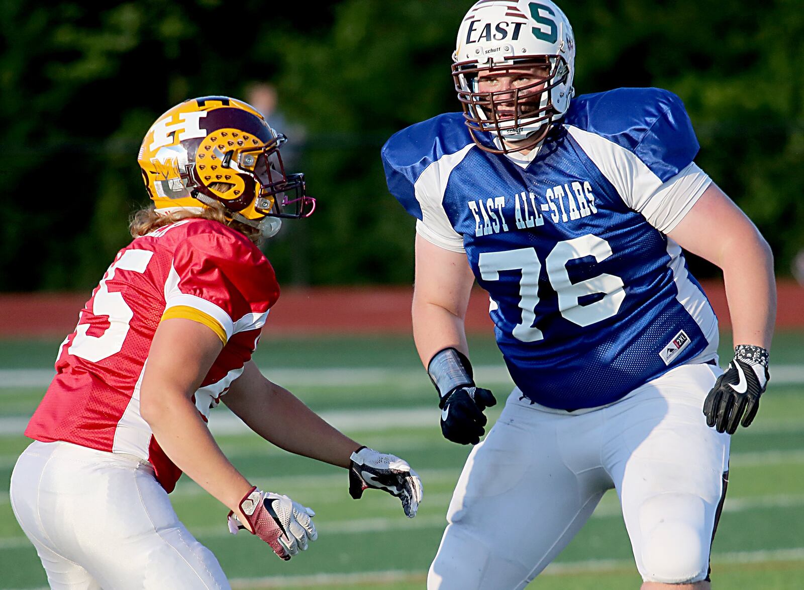 The West’s Eric Allgeier of Ross takes on the East’s Clark Willhoite of Roger Bacon during Thursday night’s Southwestern Ohio Football Coaches Association Ron Woyan East-West All-Star Game at Kings. CONTRIBUTED PHOTO BY E.L. HUBBARD