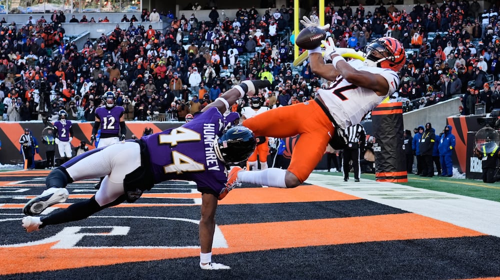 Baltimore Ravens cornerback Marlon Humphrey (44) breaks up a pass intended for Cincinnati Bengals wide receiver Mitchell Tinsley (82) during the second half of an NFL football game, Sunday, Dec. 14, 2025, in Cincinnati. (AP Photo/Carolyn Kaster)