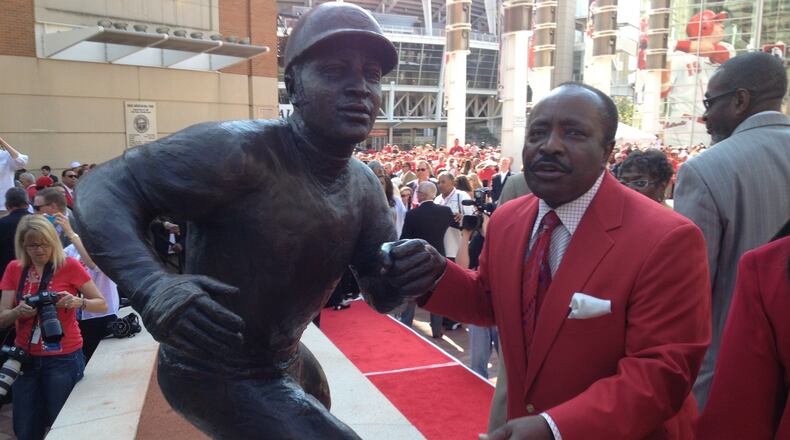 Hall of Famer Joe Morgan stands next to his statue. LOT TAN / STAFF