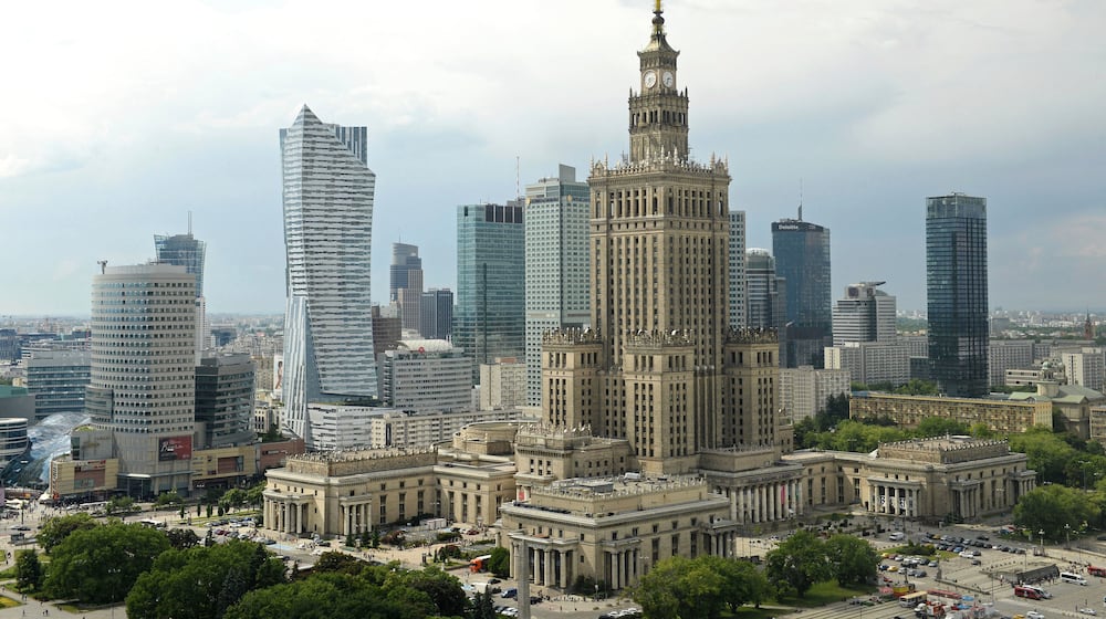FILE - Newer skyscrapers flank the communist-era Palace of Culture and Science, foreground, in n, Poland, May 25, 2018. (AP Photo/Alik Keplicz, File)