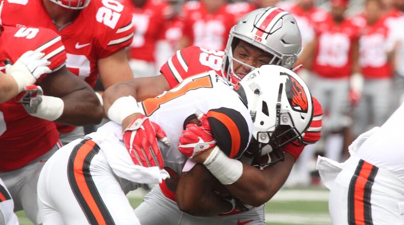 Ohio State’s Malik Harrison tackles Oregon State’s Artais Pierce on Saturday, Sept. 1, 2018, at Ohio Stadium in Columbus. David Jablonski/Staff