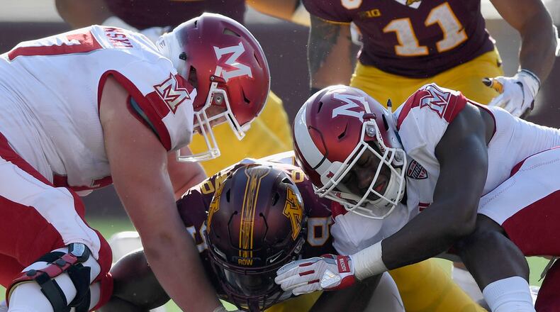 Esezi Otomewo #9 of the Minnesota Golden Gophers recovers a fumble against Matt Skibinski #77 and Dominique Robinson #11 of the Miami RedHawks during the third quarter of the game on September 15, 2018 at TCF Bank Stadium in Minneapolis, Minnesota. (Photo by Hannah Foslien/Getty Images)