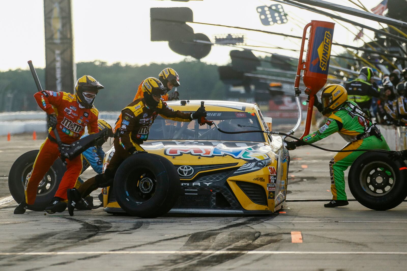 FILE - Kyle Busch makes a pit stop during the NASCAR Cup Series auto race at Pocono Raceway, June 28, 2020, in Long Pond, Pa. (AP Photo/Matt Slocum, file)
