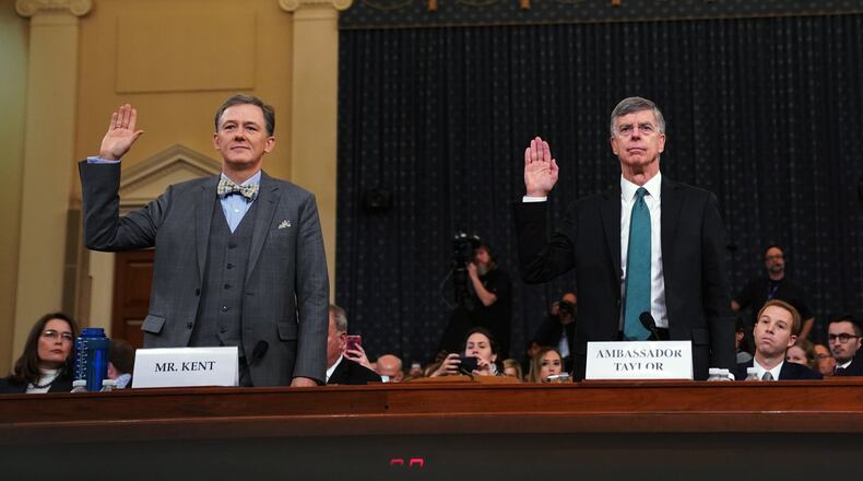 From left, George Kent, a senior State Department official in charge of Ukraine policy, and William Taylor, the top U.S. diplomat in Ukraine, are sworn in before the House Intelligence Committee in Washington on Wednesday, Nov. 13, 2019. Lawmakers are considering whether to impeach President Donald Trump for what Democrats say was an effort to use the power of his office for political gain. (Erin Schaff/The New York Times)
