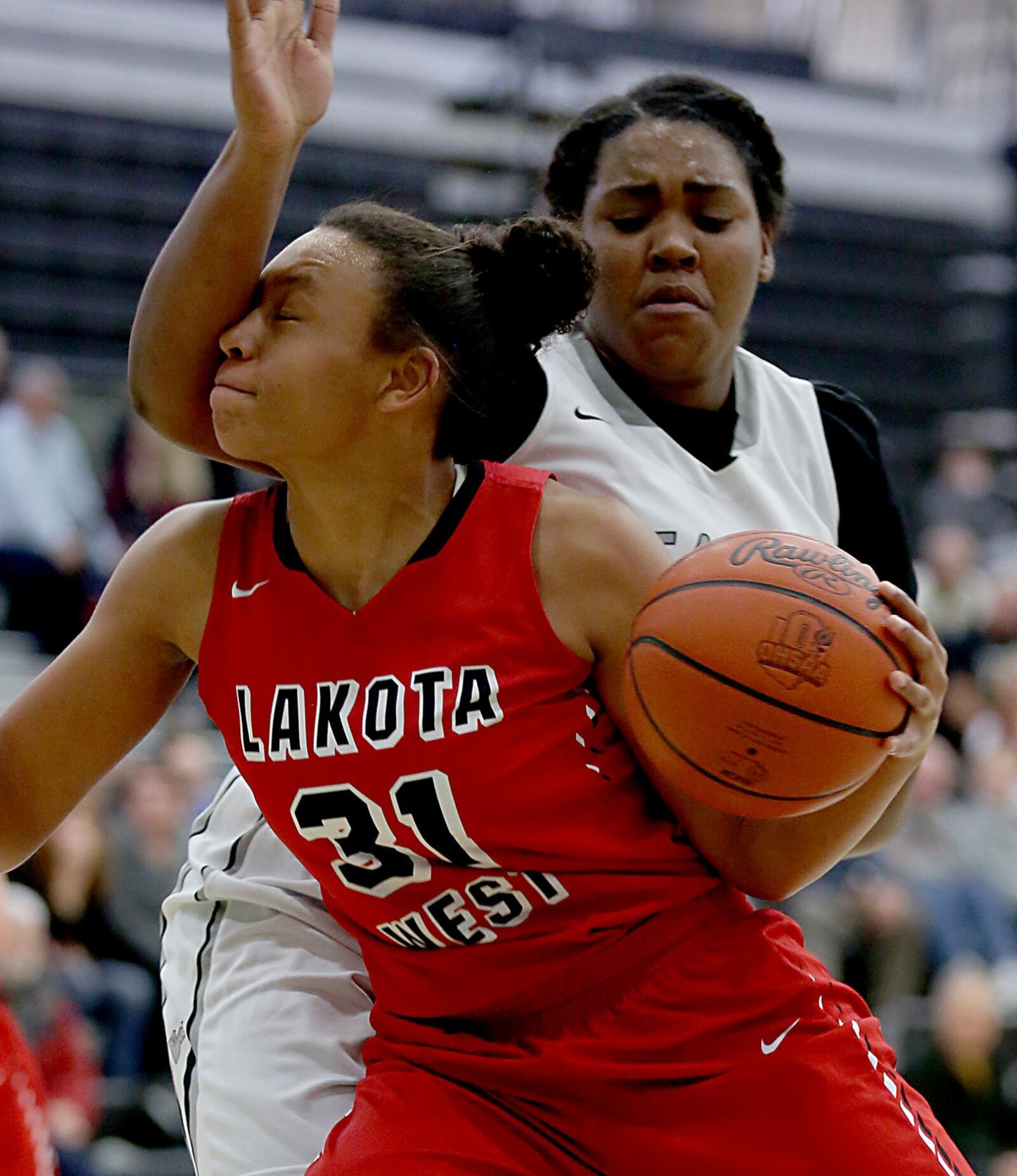 Lakota West forward Nevaeh Dean tries to move past Lakota East forward Secret Hughes on Wednesday night at East. CONTRIBUTED PHOTO BY E.L. HUBBARD
