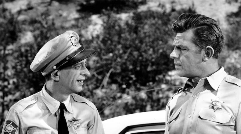 Andy Taylor played Andy Griffith on "The Andy Griffith Show." He is seen here, right, in a scene with the character Barney Fife, played by Don Knotts. FILE