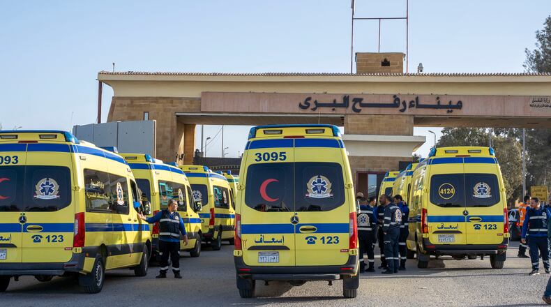 Ambulances line up to enter the Egyptian gate of the Rafah crossing on the way to the Gaza Strip, in Rafah, Egypt, Sunday, Feb. 1, 2026. (AP Photo/Mohamed Arafat)