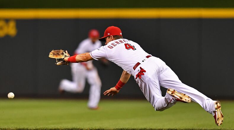 Scooter Gennett dove for but missed this ground ball Saturday against the Nationals at Great American Ball Park, yet he's not going to be missing many games any time soon. The Reds' utility man has been one of MLB's most productive offensive players for the last six weeks or so, and manager Bryan Price said that means he's going to keep playing multiple positions.