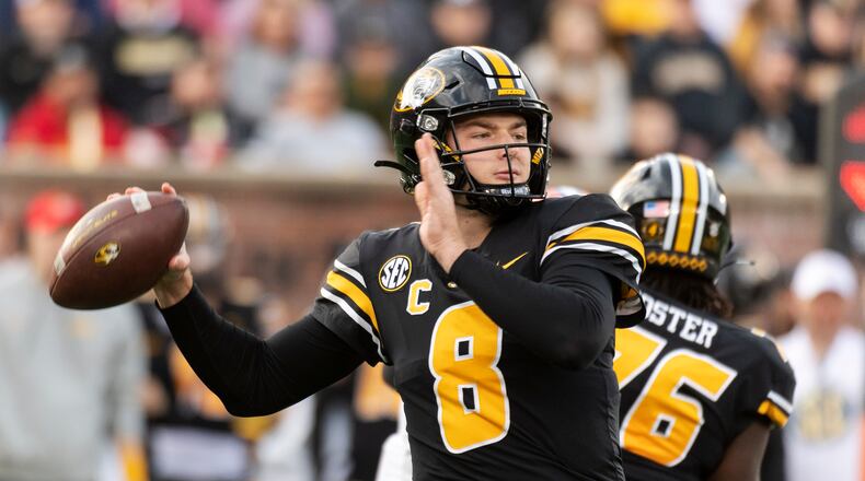 Missouri quarterback Connor Bazelak looks to pass during the first quarter of an NCAA college football game against Florida, Saturday, Nov. 20, 2021, in Columbia, Mo. (AP Photo/L.G. Patterson)