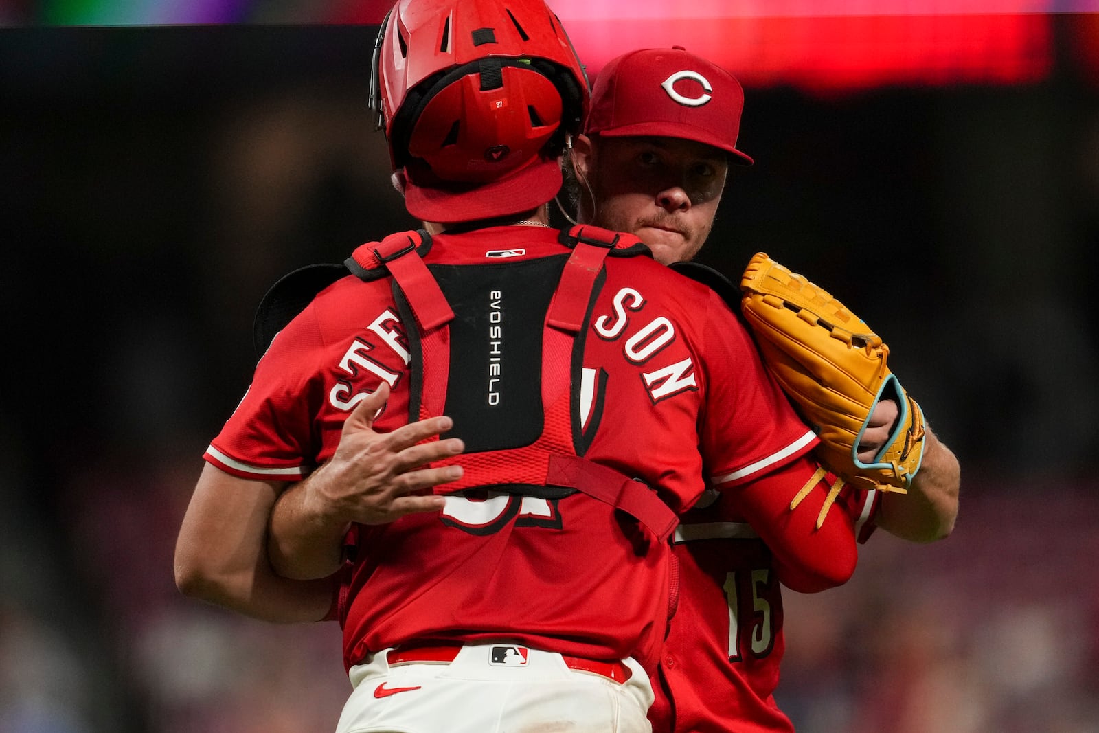 Cincinnati Reds' Tyler Stephenson, left, celebrates with teammate Emilio Pagán following a baseball game against the Minnesota Twins, Tuesday, June 17, 2025, in Cincinnati. (AP Photo/Jeff Dean)