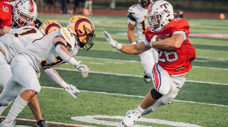 Talawanda running back Lance Cantrell rushes with the football against Ross on Friday night. JORDAN PHILLIPS / CONTRIBUTED