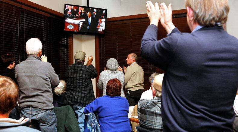 Butler County Democrats members cheer following President Barack Obama’s State of the Union 2014 address during a watch party on Jan. 28, 2014, at Champps in West Chester Twp.