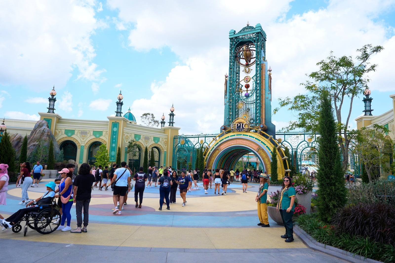 Guests arrive at the main entrance to Epic Universe Theme Park at Universal Resort Orlando Thursday, April 10, 2025, in Orlando, Fla. (AP Photo/John Raoux)