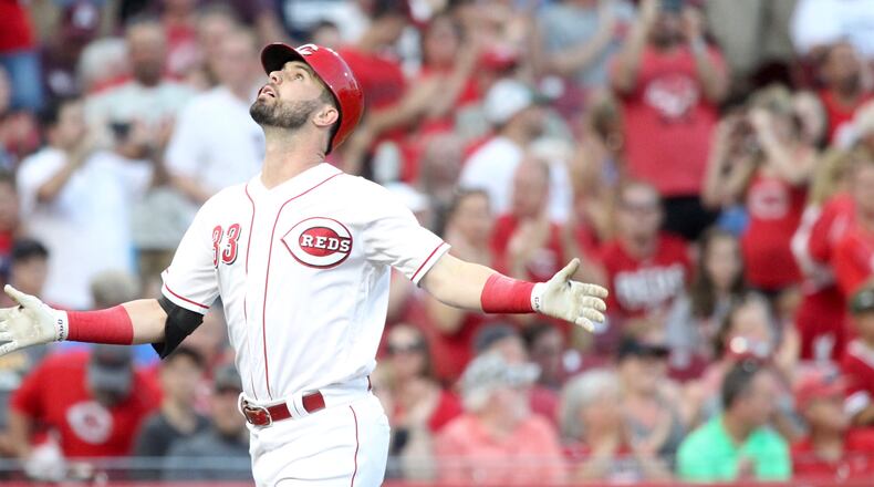 The Reds’ Jesse Winker crosses home plate after a two-run home run in the third inning on Thursday, June 28, 2018, at Great American Ball Park in Cincinnati. David Jablonski/Staff