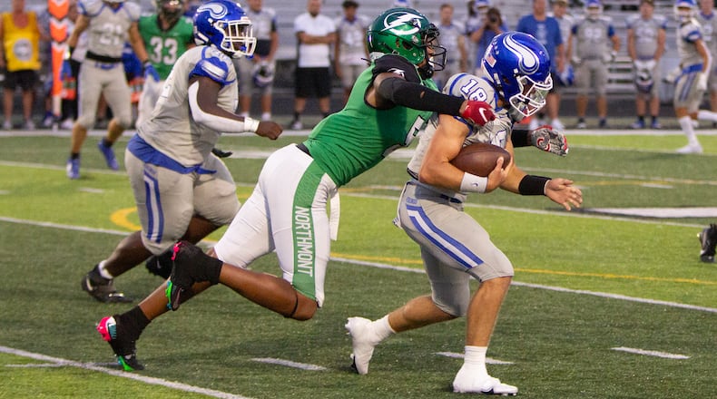 Northmont defensive end Cedric Works sacks Miamisburg's Preston Barr in the first half Thursday night. Jeff Gilbert/CONTRIBUTED
