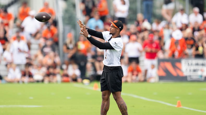 Cincinnati Bengals wide receiver Ja'Marr Chase (1) catches a pass during the NFL football team's training camp on Wednesday, July 24, 2024, in Cincinnati. (AP Photo/Emilee Chinn)