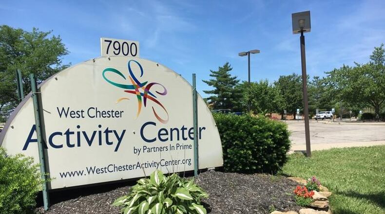 A company seeking to build a giant new Kroger on the West Chester site that includes an activity center has made some concessions while trying to finalize the $1.8 million deal.