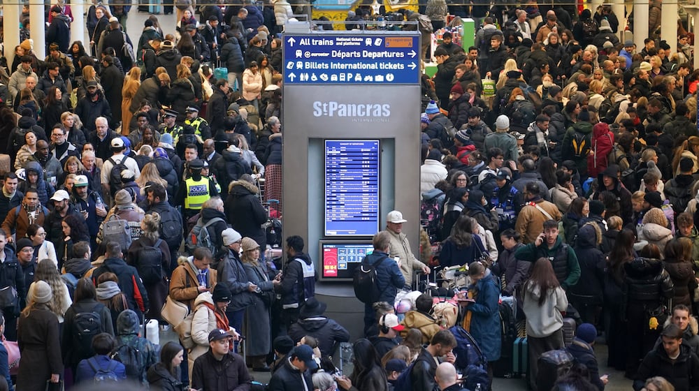 Travelers queue for Eurostar services at St Pancras International station in London, Tuesday, Dec. 30, 2025. (AP Photo/Alberto Pezzali)