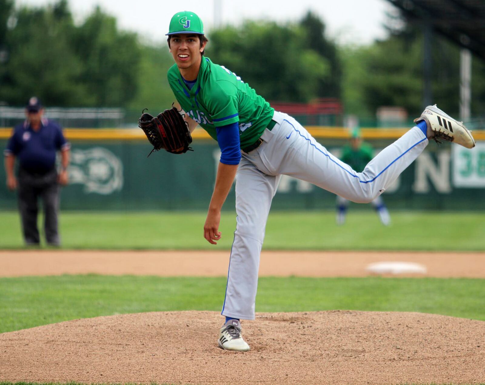 Chaminade Julienne’s Sebastian Gongora fires to the plate Sunday during the Eagles’ 6-0 victory over Ross in a Division II regional baseball final at Mason. MIKE HARTSOCK/STAFF