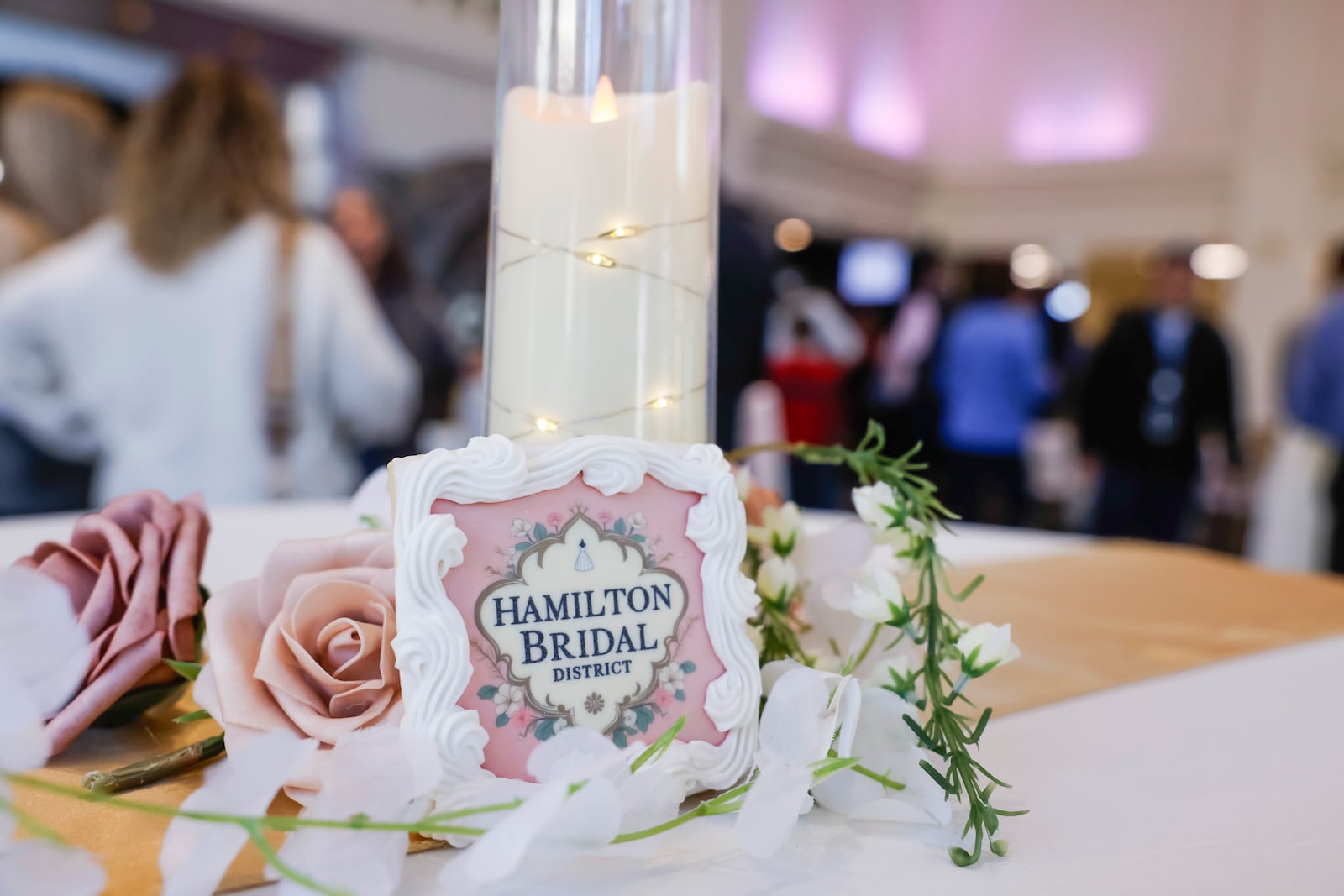 The Hamilton Bridal District held a veil cutting for their official launch Wednesday, Feb. 11, 2026. The district brings together Hamilton-area wedding-related businesses, including venues, hotels, service providers and planners, under a unified local organization. A reception was held after the ribbon cutting at The Benison coworking and event space with cookies and cupcakes by Luke's Custom Cakes. NICK GRAHAM/STAFF