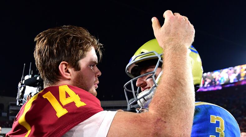 LOS ANGELES, CA - NOVEMBER 18:  Josh Rosen #3 of the UCLA Bruins and Sam Darnold #14 of the USC Trojans meet on the field after a 28-23 Trojan win at Los Angeles Memorial Coliseum on November 18, 2017 in Los Angeles, California.  (Photo by Harry How/Getty Images)