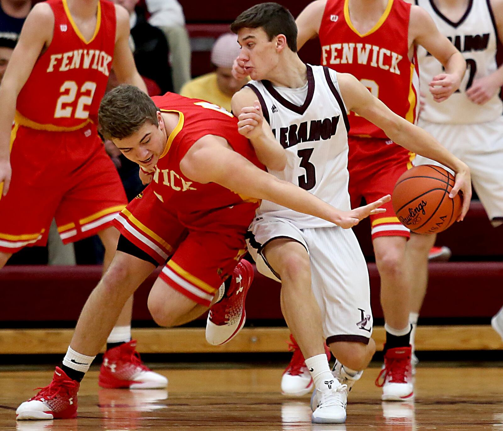 Fenwick center Sammy DeBiasi tries to execute a steal on Lebabon guard Drew Sekerak during their game at Lebanon on Saturday night. CONTRIBUTED PHOTO BY E.L. HUBBARD