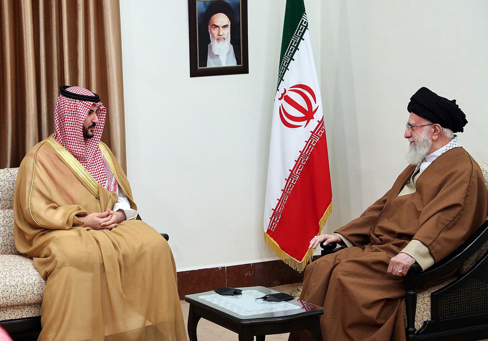 In this photo released by the official website of the office of the Iranian supreme leader, Supreme Leader Ayatollah Ali Khamenei, right, listens to Saudi Arabia's Defense Minister Prince Khalid bin Salman during their meeting in Tehran, Iran, Thursday, April 17, 2025. (Office of the Iranian Supreme Leader via AP)