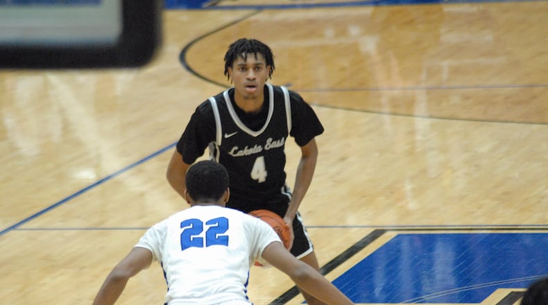Lakota East's Julian Mitchell (4) is guarded by Hamilton's Demetrius Berry (22) during their game on Jan. 3, 2023. Chris Vogt/CONTRIBUTED