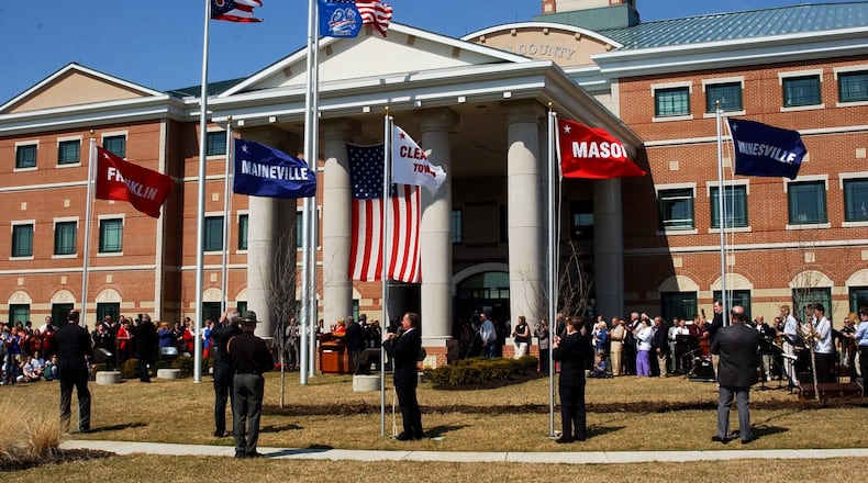 City and township flags are raised outside the Warren County Administration Building. FILE PHOTO