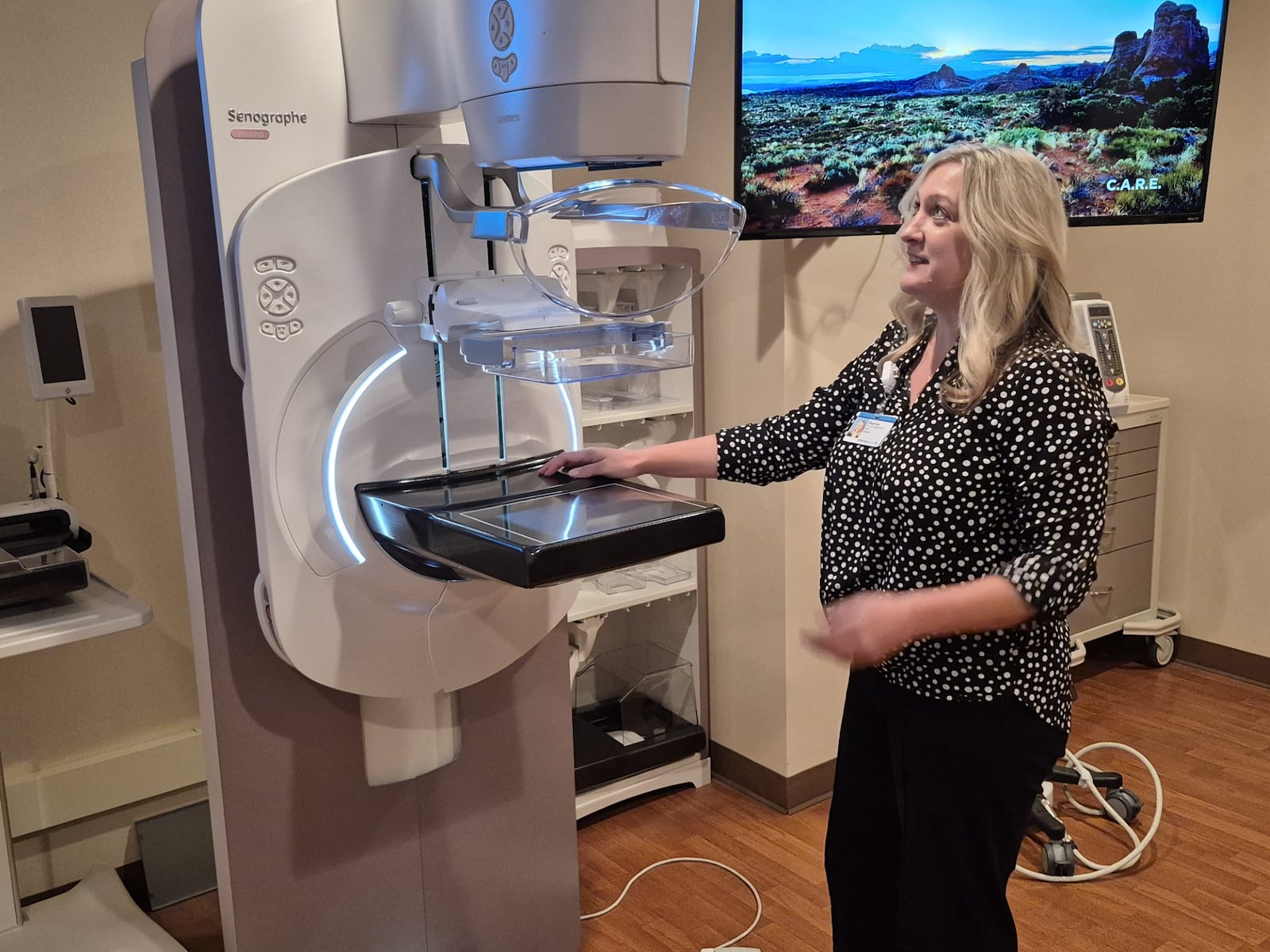 Deanne Rose, director of Kettering Health Breast Centers, demonstrates the latest mammography unit with sensory suite. MICHAEL KURTZ / STAFF