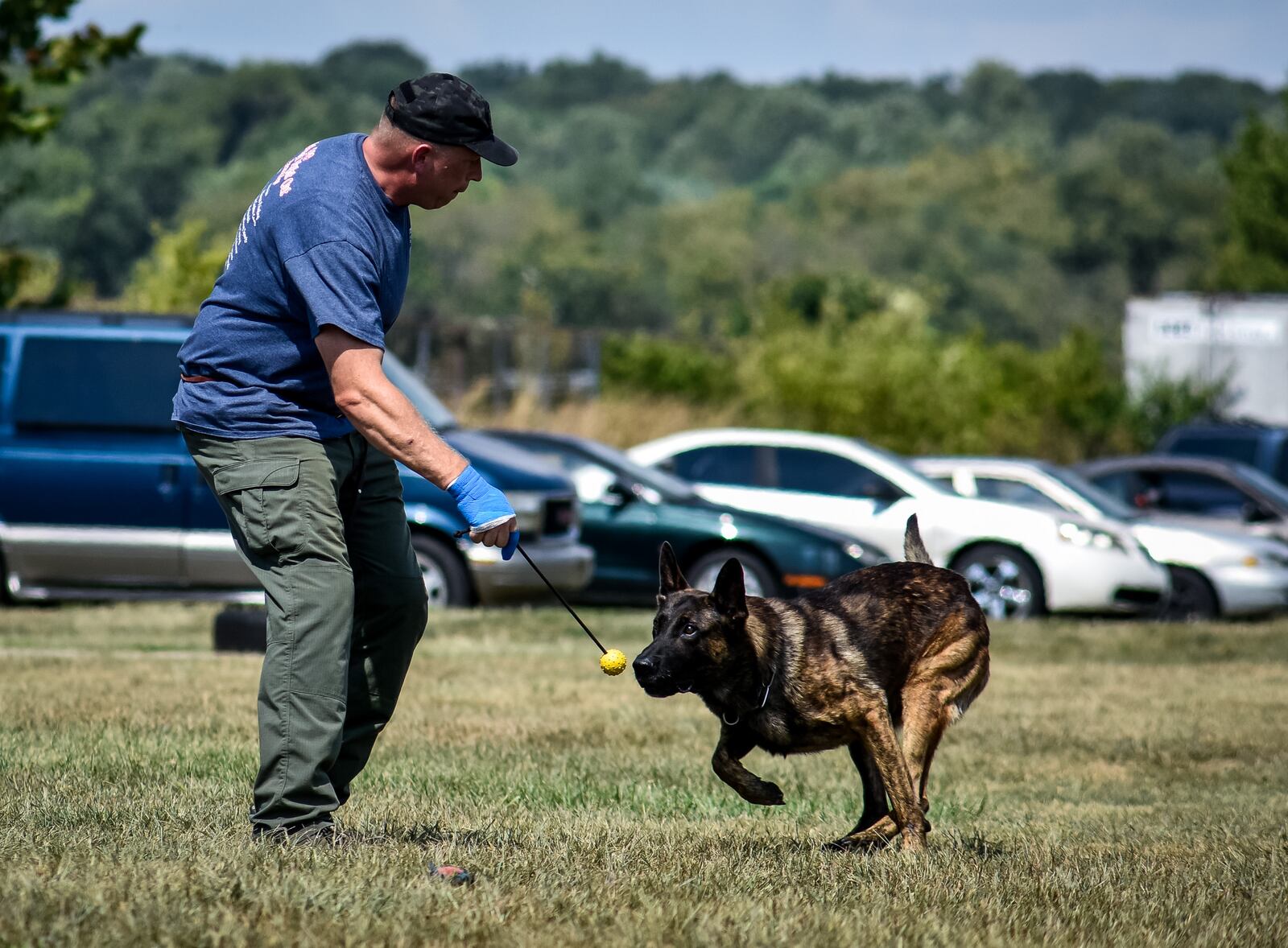Middletown Police officer Denny Jordan with his K-9 Koda at the Middletown police canine training facility. NICK GRAHAM / STAFF