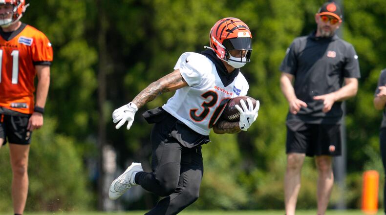 Cincinnati Bengals running back Chase Brown (30) runs during NFL football practice, Tuesday, June 4, 2024, in Cincinnati. (AP Photo/Jeff Dean)