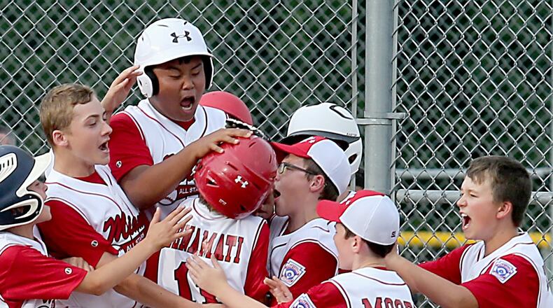 Miami Little League players celebrate a home run during the 2016 Little League District 9 tournament. Due to a lack of volunteers, Miami Little League may be forced to turn over two of its programs to the Oxford Parks and Recreation Department, which would mean forfeiting players’ ties to Little League. FILE PHOTO/2016
