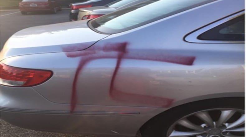 This is one of four cars spray painted sometime between midnight Friday and mid-day Saturday at Arbor Pointe Apartments & Townhomes in Fairfield. Four other cars had tires slashed. (WCPO)