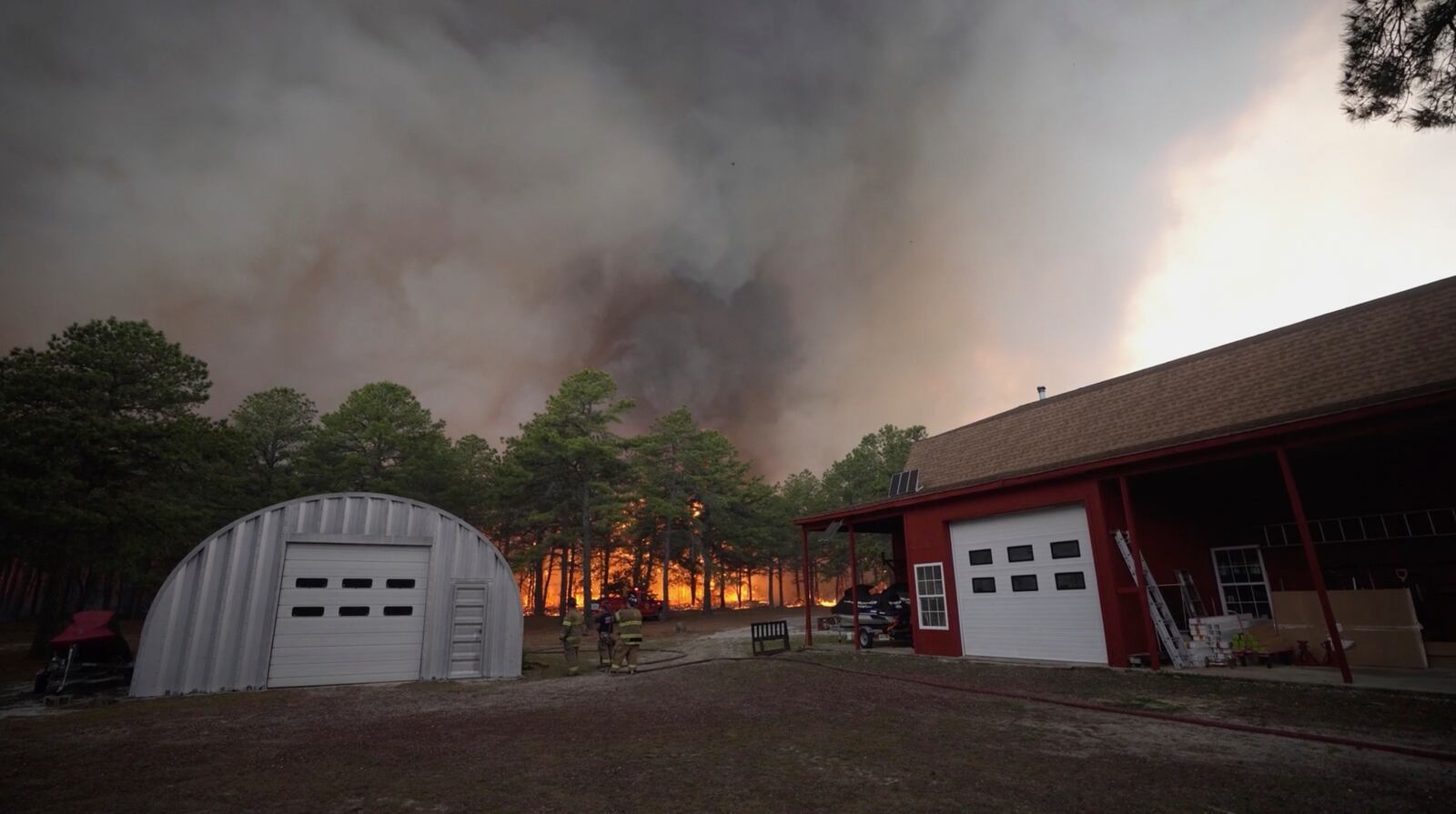 Smoke fills the sky as firefighters battle a wildfire in Lacey Townships, N.J. on Tuesday, April 22, 2025. (New Jersey Department of Environmental Protection via AP)