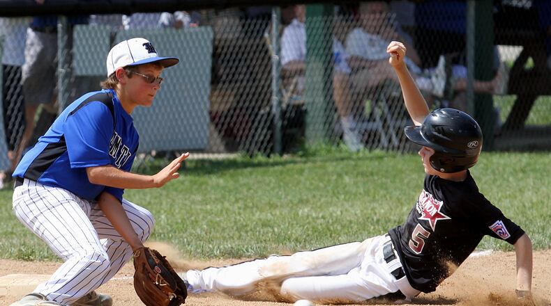 Hamilton third baseman Alex Mills gets the ball too late to make a play on Lebanon baserunner Jimmy Myers during their game at West Side Little League in Hamilton Saturday, July 13, 2013. CONTRIBUTED PHOTO BY E.L. HUBBARD