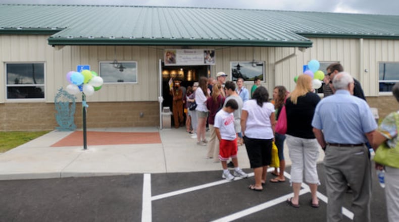 FILE: A long line of people wait to tour the new building during a day-long event on Saturday, August 22, 2009 celebrating the opening of the Animal Friends Humane Society's new animal shelter 1820 Princeton Road in Hamilton.