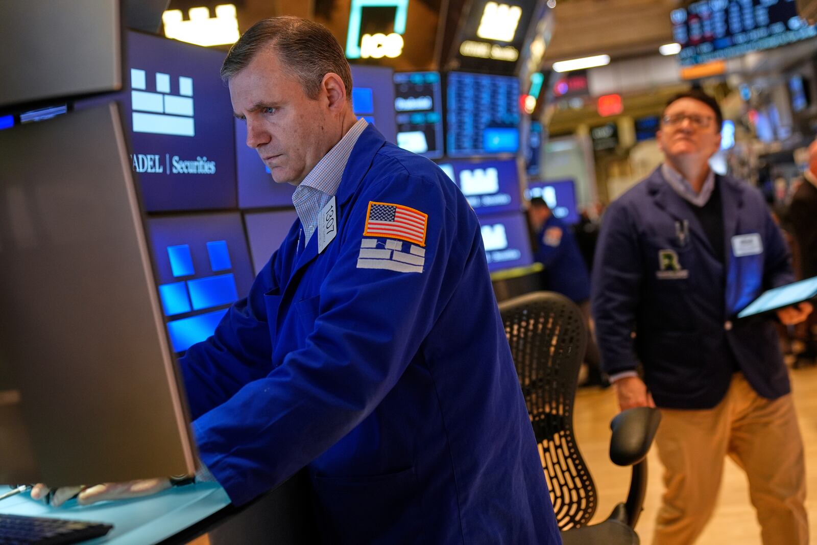 Thomas Schreck works on the floor at the New York Stock Exchange in New York, Tuesday, April 8, 2025. (AP Photo/Seth Wenig)