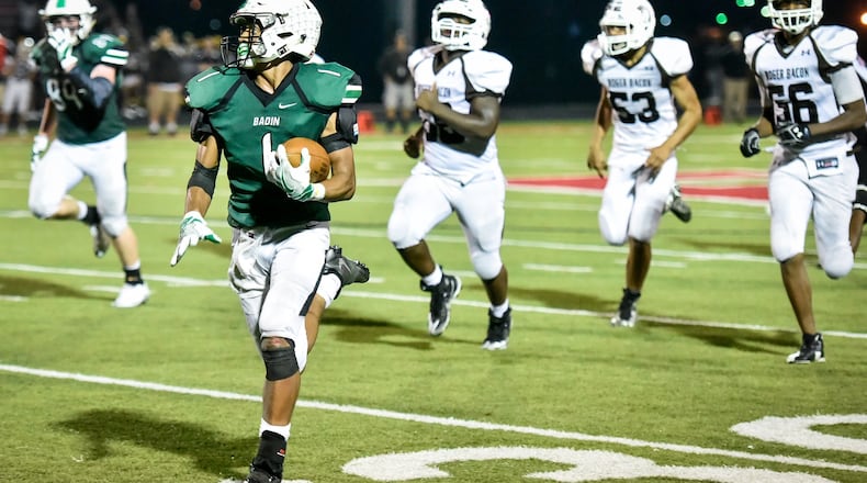 Badin’s Davon Starks carries the ball for a touchdown during a 41-21 win over Roger Bacon on Sept. 22 at Fairfield Stadium in Fairfield. NICK GRAHAM/STAFF