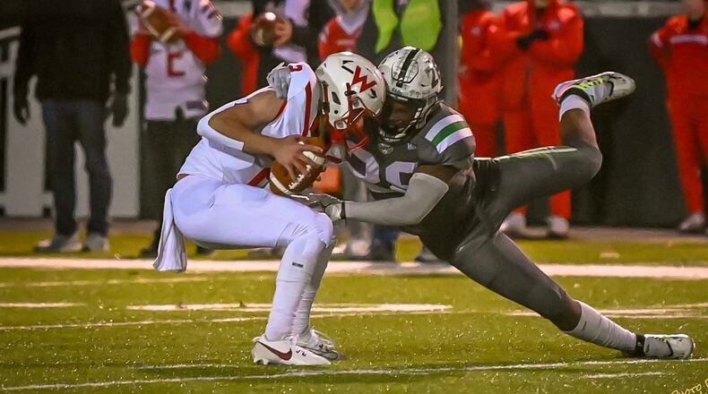 Badin's Royce Rachel makes a tackle during the Rams' 14-10 Division III, Region 12 semifinal win over Wapakoneta last Friday at Greenville. BETSEY MIYAHARA/CONTRIBUTED