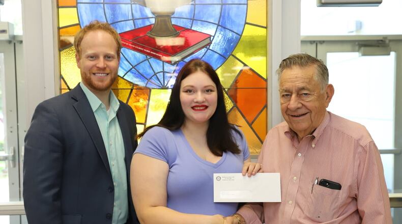 Alexis Bruce is pictured with Daniel Tryon, president of Middletown Rotary Club, and Mike Friedman, chair of Perk Up Middletown. Bruce’s artwork is featured on a utility box at Central Avenue and Main Street. SUBMITTED PHOTO
