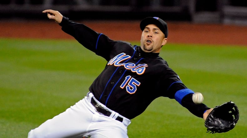 FILE - New York Mets right fielder Carlos Beltran lunges for the ball during the third inning of an MLB baseball game against the Arizona Diamondbacks, April 22, 2011 in New York. (AP Photo/Bill Kostroun, File)