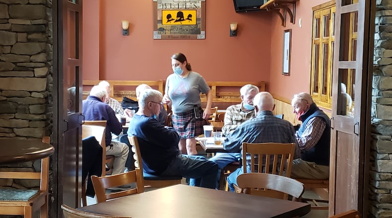 At least six tables of customers gather at Dingle House Irish Pub & Grub in West Chester Twp. before noon to partake of the restaurant's temporarily pared down menu. CONTRIBUTED