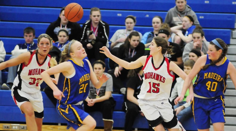 Madison’s Josey Harding (32) and Michelle Brunswick (15) make a turn over Madeira’s Mallory Kline (20) during a Division III tournament game in Springfield on March 2, 2013. JOURNAL-NEWS FILE PHOTO