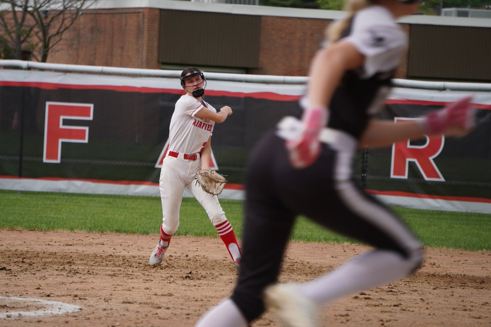 Fairfield's Adelyn Huey makes a throw to first base during her game against Lakota East on Monday at Creekside Middle School. CHRIS VOGT/CONTRIBUTED PHOTO