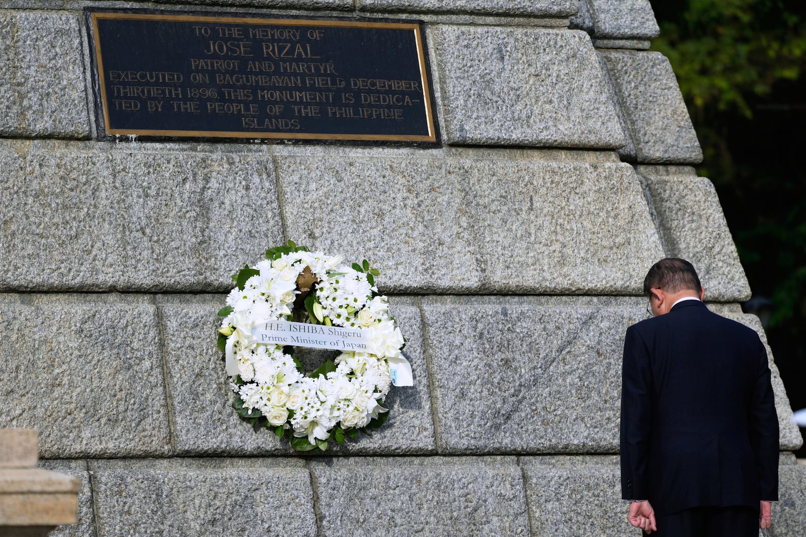 Japanese Prime Minister Shigeru Ishiba bows after laying a wreath at the monument of Philippine National Hero Jose Rizal in Manila, Philippines on Tuesday, April 29, 2025. (AP Photo/Aaron Favila)