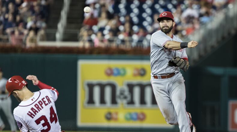 WASHINGTON, DC - AUGUST 02: Jose Peraza #9 of the Cincinnati Reds turns a double play against the Cincinnati Reds during the ninth inning at Nationals Park on August 02, 2018 in Washington, DC. (Photo by Scott Taetsch/Getty Images)