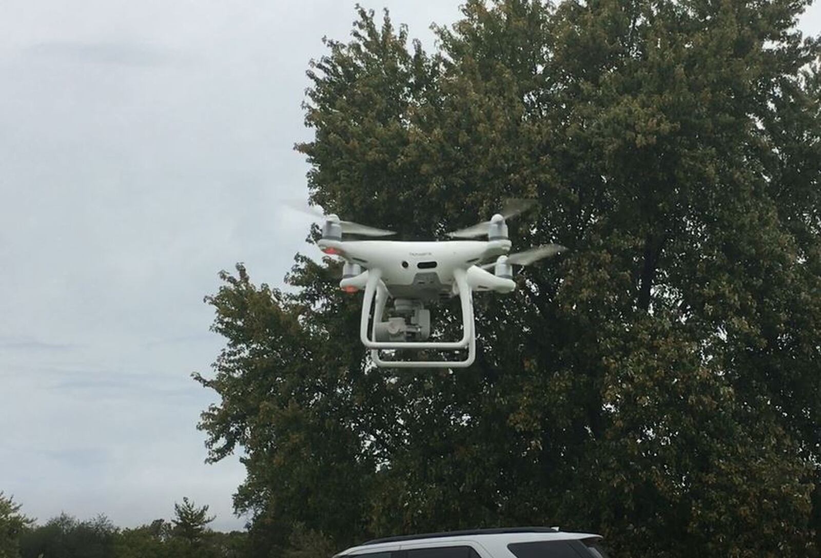 Hamilton’s new drone takes off at Joyce Park. The machine should make it much faster for electric crews to search for wires that are down after storms, and will have other benefits. MIKE RUTLEDGE/STAFF