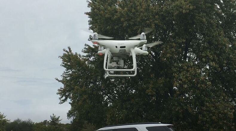 Hamilton’s drone, purchased a few years ago, takes off at Joyce Park. The machine make it much faster for electric crews to search for wires that are down after storms, and has other benefits. MIKE RUTLEDGE/STAFF