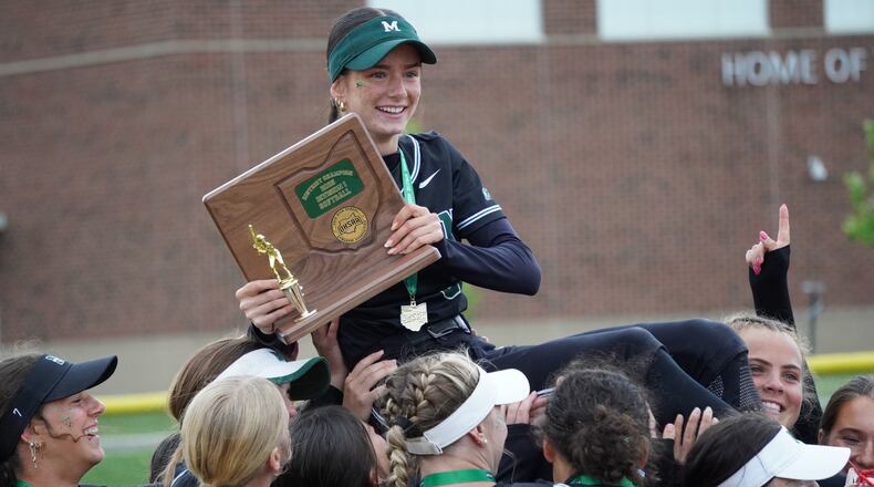 Mason senior Annabelle Geiser celebrates with his teammates after the Comets beat Springboro 10-1 in a Division I district final on Thursday at Lebanon. CHRIS VOGT / CONTRIBUTED